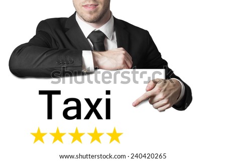 businessman in black suit pointing on sign taxi five stars