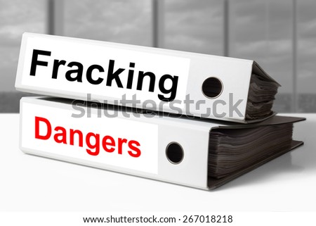 white stack of office binders fracking dangers