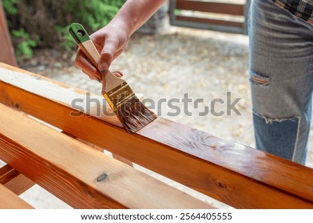 Similar – Image, Stock Photo Artisan polishing wooden detail using sandpaper in carpentry workshop