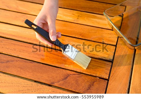 Similar – Image, Stock Photo Glaze. Woodwork, painting wood. Hand of the craftsman painting a wooden door. Concept of renovation work, carpentry and woodwork. painter, painting wooden surface, wood preservation