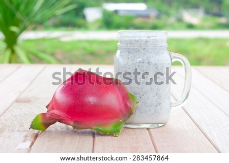 Dragon fruit smoothie on wooden table