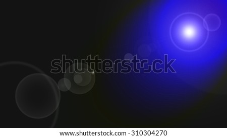 White and blue lens flare photo effect produced by refracted light on black dark background. Suitable for presentations, web, backdrops, prints and overlaying text