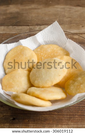 Tray of freshly fried arepas, typical Latin American food made with cornmeal.
