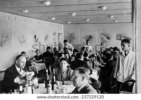Dining 2000 feet in the air on the Hindenburg with wine on every table Dr.Hugo Eckener, the manager of the Luftschiffbau Zeppelin, May 10, 1936.