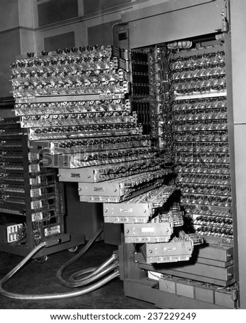 Staged trays of a French electronic brain 350 electronic tubes and 8000 replacing tubes are used in the computer.