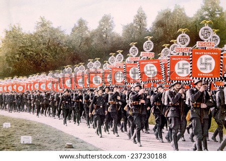 Nazi Germany, Nazi SS troops marching with victory standards at the Party Day rally in Nuremberg, 1933.