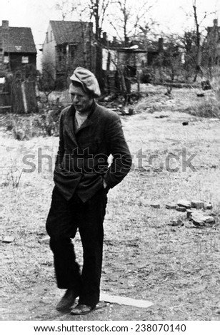 The Great Depression A poor man walking through a vacant lot 1930s