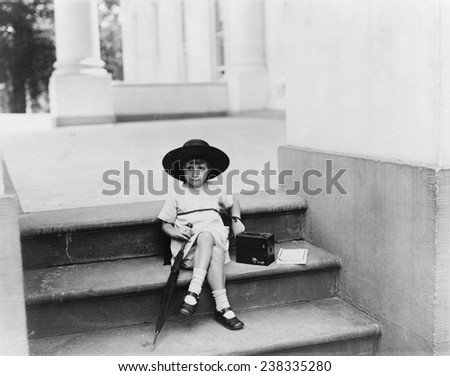 Waiting for the President, a young girl sits on the White House steps with a camera waiting for President Warren G. Harding, photograph by Mrs. W. Tarkington, Washington DC, June 29, 1922.
