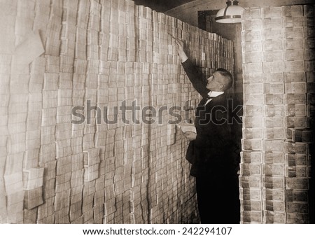 Piles of German money in a Berlin bank during the post-World War I hyper-inflation. In 1923 an American dollar was worth 800 million German marks.