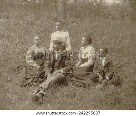 Middle class African American family seated on lawn in Georgia, ca. 1899.