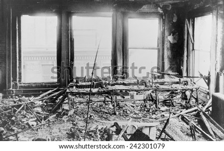 Triangle Shirtwaist Factory interior, destroyed sewing machines, gutted by a fire that killed 146 on March 15, 1911. Managers locked fire exits to prevent thefts, trapping immigrant women workers.