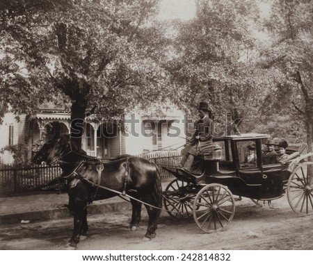 African American family in a fine horse-drawn carriage in Atlanta, Georgia owned by undertaker David Tobias Howard, riding with his mother, and wife. Ca. 1899