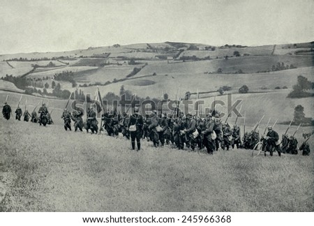 WWI. French infantry climbing a hill of the rolling country of North Eastern France. Ca. 1914-15.