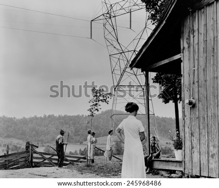 Rural electrification in the Tennessee Valley. A meter has been installed on the rural home to measure the electricity delivered from TVA (Tennessee Valley Authority) transmission line. Ca. 1943-44.