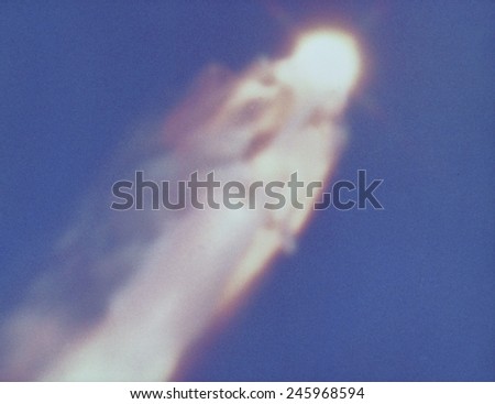 Space shuttle Challenger disaster. Challenger is completely engulfed in a fiery flow of escaping liquid propellant. Jan. 28, 1986.