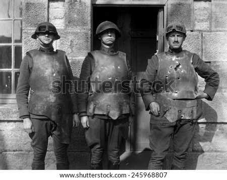 French soldiers in heavy weight body armor showing effect of pistol, rifle, and machine gun fire. Ordnance Department body armor test at Fort de la Peigney, Langres, France. WWI. Ca. 1918.