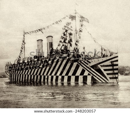 British WW1 transport Osterle camouflaged with Zebra stripes. Nov. 11, 1918. In New York Harbor, she was decked with flags to celebrate the armistice.