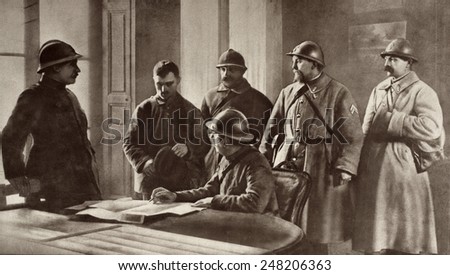 French officers interrogating a German prisoner during World War 1. Probably 1914. He was captured at Moronvilliers, France, the site of fighting in Sept 1914.