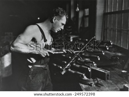 Worker building rubber dolls molds in Work Projects Administration funded employment, Dec. 1936-July 1937. Photo by Lewis Hine.