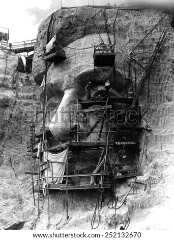 Workers under the direction of Sculptor Gutzon Borglum carve head of Lincoln. Head is granite and measures 66 feet from chin to crown, South Dakota Black Hills, September 20, 1937.