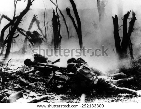 World War I, American troops in the 23 Infantry of the 2nd Division fire at German soldiers, France. Photo undated.