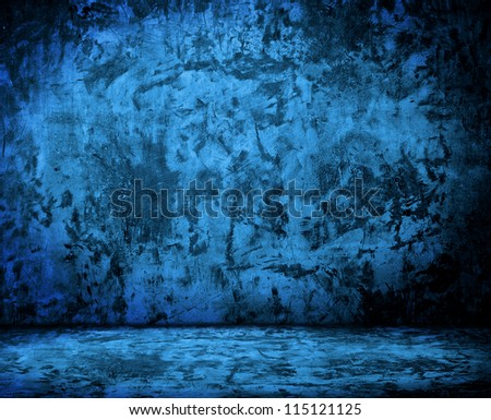 blue empty room with grunge concrete wall and cement floor