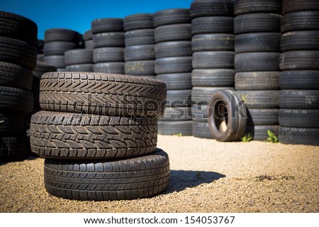 Stack of new tires for sale at a tire store.