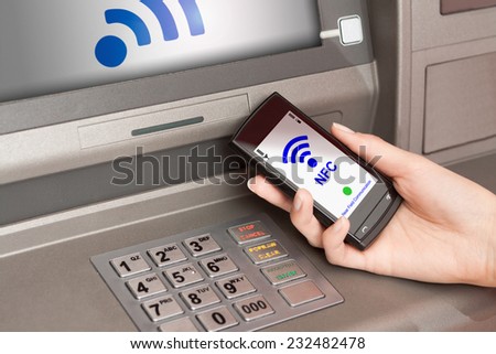 withdrawing money from atm with a mobile phone a NFC terminal
