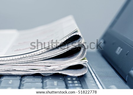 newspapers on the laptop