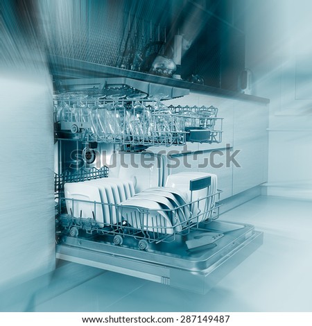Open dishwasher with clean utensils in it.