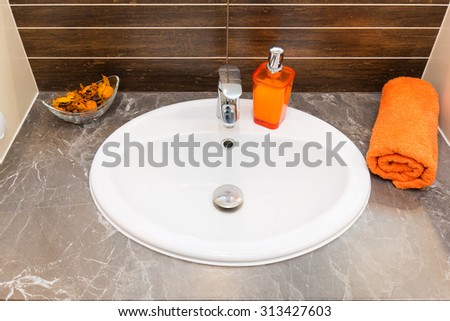Close up of a wash basin in a modern bathroom interior.