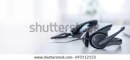 Communication support, call center and customer service help desk. VOIP headset on laptop computer keyboard. ストックフォト © 