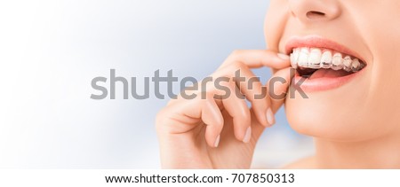 Similar – Image, Stock Photo Woman with mouthguard and disposable gloves reads on smartphone