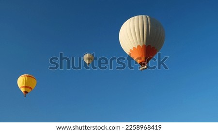 Similar – Foto Bild Heißluftballons gegen den untergehenden Himmel