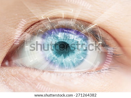 Close-up of woman\'s blue eye. High Technologies in the futuristic. : contact lens