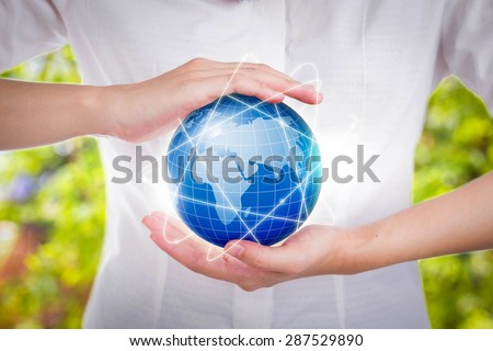 Female hands save environment keep in the world blue planet.