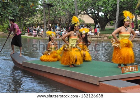 OAHU, HAWAII - DECEMBER 26: Students perform traditional Tahitian dance at a canoe pageant at the Polynesian Cultural Center in Oahu, Hawaii on December 26, 2012.
