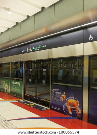 DUBAI, UAE - FEB 7: Dubai Metro Station in the UAE, as seen on Feb 7, 2014. It is a driverless network. Guinness World Records declared it the worlds longest fully automated metro network at 47 miles.