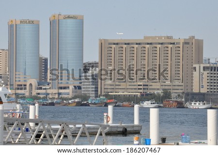 DUBAI, UAE - FEB 13: Dubai Creek in Dubai, UAE, as seen on Feb 13, 2014. The notable buildings along the Deira Creek are Deira Twin Towers, Dubai Creek Tower, National Bank, and Chamber of Commerce.
