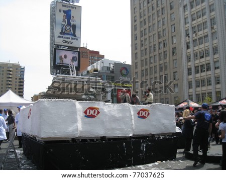 TORONTO - MAY 10: Dairy Queen makes the world\'s largest ice-cream cake on May 10, 2011 at Yonge Dundas Square in Toronto, Canada.