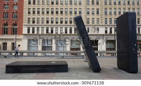 PHILADELPHIA, PA - MAY 9: Dominoes at Your Move Board Game Art Park in Philadelphia, as seen on May 9, 2015. Scattered on the Municipal Services Building plaza are oversized game pieces.