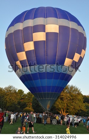 PLAINVILLE, CT - AUG 29: Balloon launch at dawn at the 2015 Plainville Fire Company Hot Air Balloon Festival held from August 28-30, 2015. Thousands of people attended this festival in its 31st year.