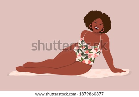 Happy African American plus size swimsuit model full of joy smiling confidant in her body, accepting and loving her full figure, wearing tropical pattern one piece swimsuit