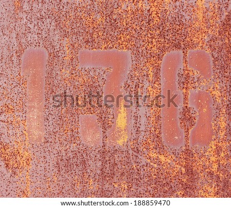 Numbers 1, 3, 6 on rusty iron wall. Old rusty metallic plate.