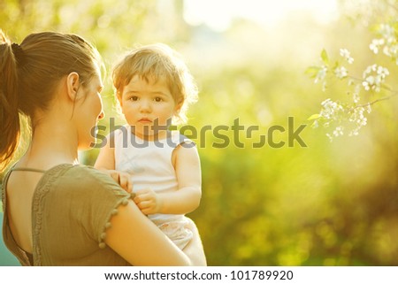 Similar – Image, Stock Photo Serious woman with blooming twigs in garden