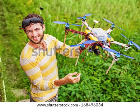 man playing with his copter