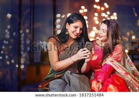 Similar – Image, Stock Photo Two beautiful sisters do their homework during quarantine. Children use gadgets for learning. Education, distance learning, home schooling during quarantine