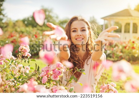 Similar – Image, Stock Photo Young woman smelling flower in the field