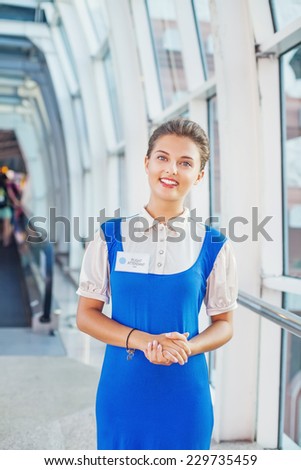 Beautiful young flight attendant in the airport