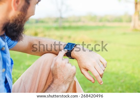 Man clicking on his smart watch. Template for smartwatch app design